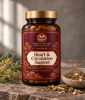 Earth Bound Botanicals Heart and Circulation Support capsules in an amber-colored bottle with a gold-toned lid and burgundy botanical label.