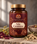 Earth Bound Botanicals Nile Goddess jar labeled Vaginal Wellness, with an amber-colored container, gold-toned lid, and burgundy botanical label.